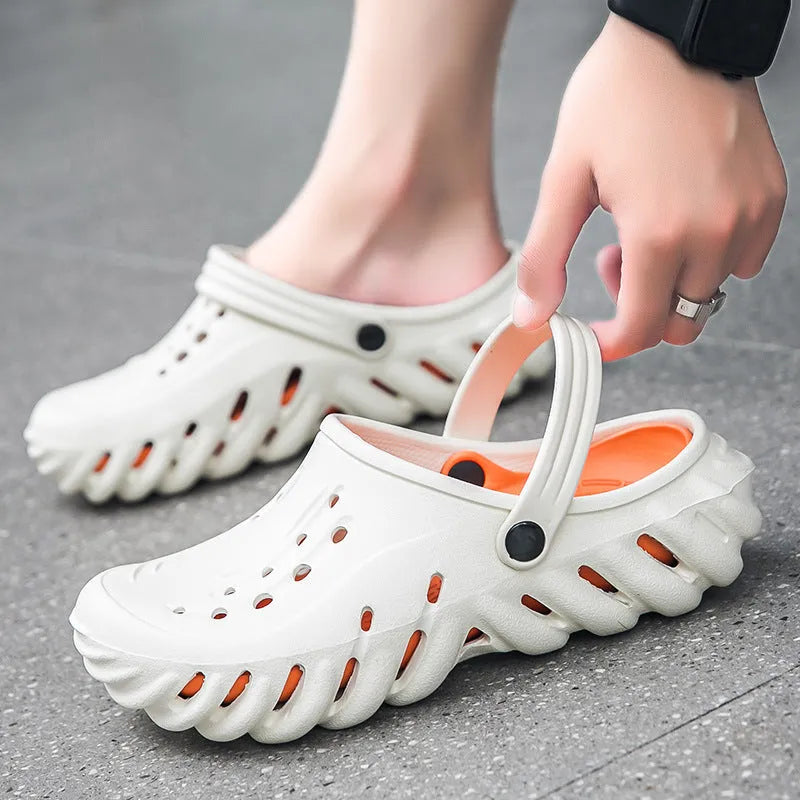 Men's beige EVA slipper sandals with hollow-out design and non-slip sole, shown from a side angle.
