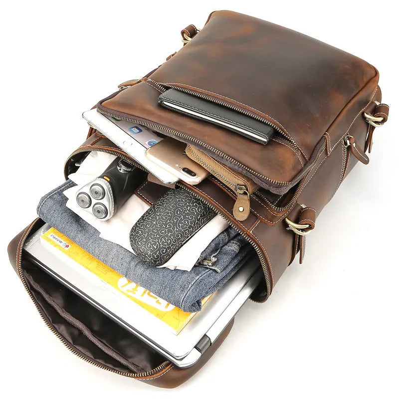 Large brown leather backpack with zipper closure, under 20L capacity