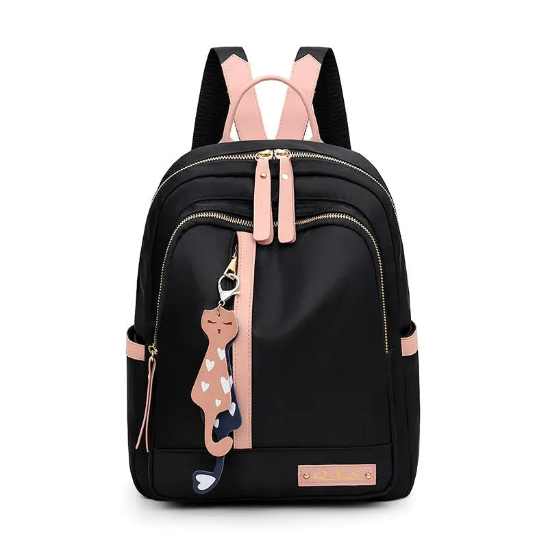 A black soft nylon women's casual travel backpack with double straps and multiple internal compartments.
