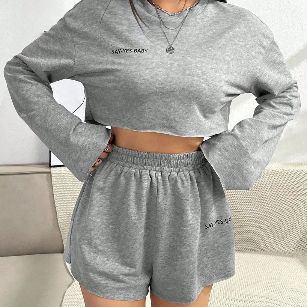 Grey women's long-sleeved t-shirt and short loungewear set laid flat showing both pieces