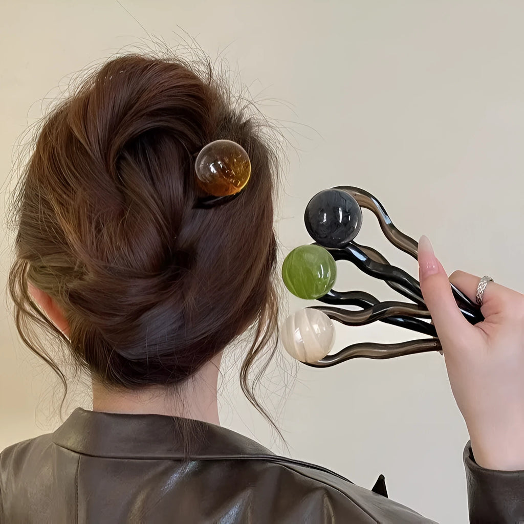 Acrylic U-shaped hair barrette with a retro ball design in a simple style.