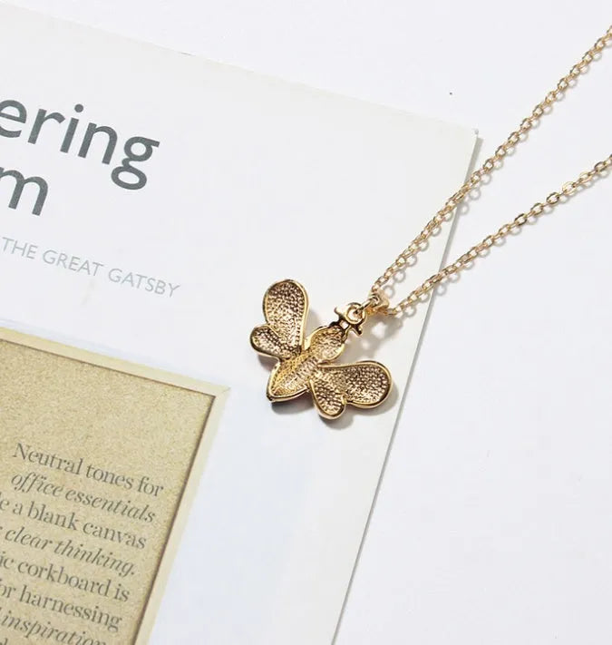 Cartoon bee drop pendant necklace with oil studded alloy finish on cross chain, yellow colour option, on white background