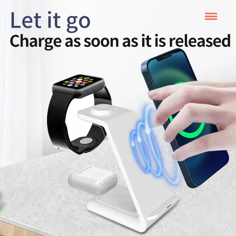 White 3-in-1 upright wireless charging stand holding a mobile phone in landscape orientation on a desk.