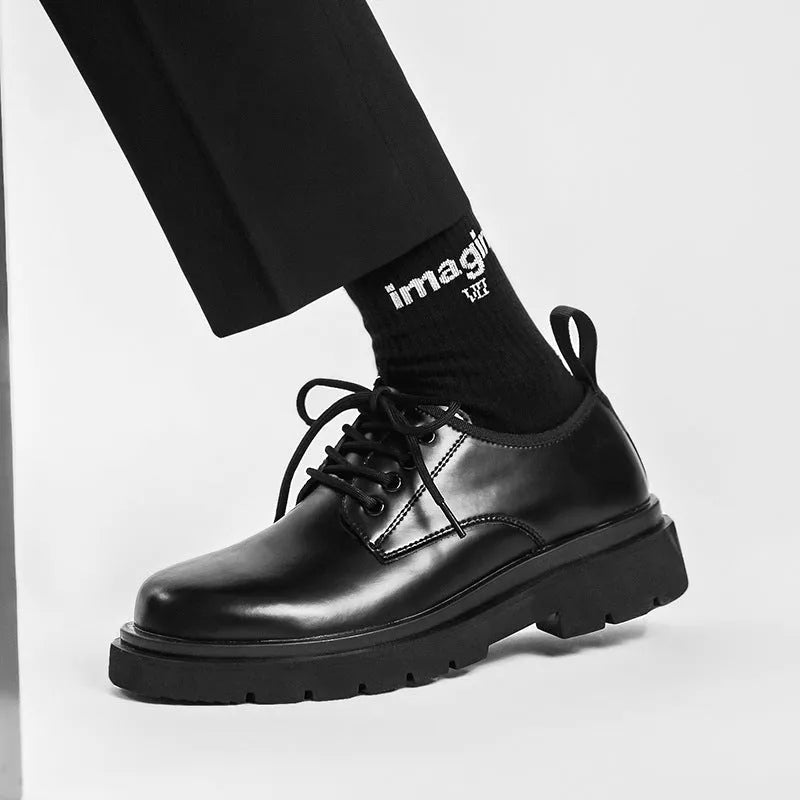 Men's black round-toe leather shoes with thick rubber sole and lace-up closure