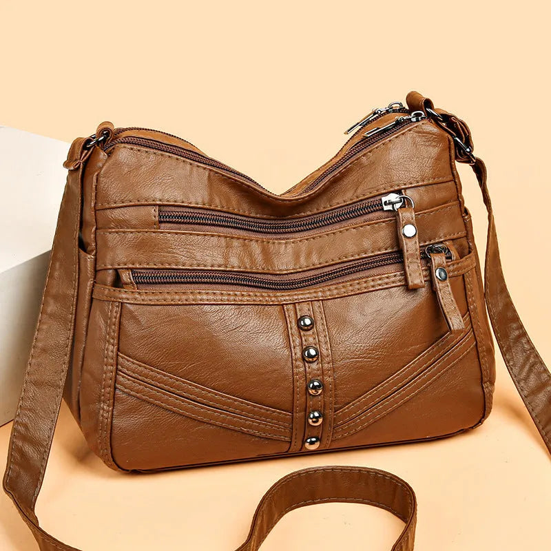 Ladies soft PU messenger bag in vintage style, available in black, brown, and red, horizontal square shape