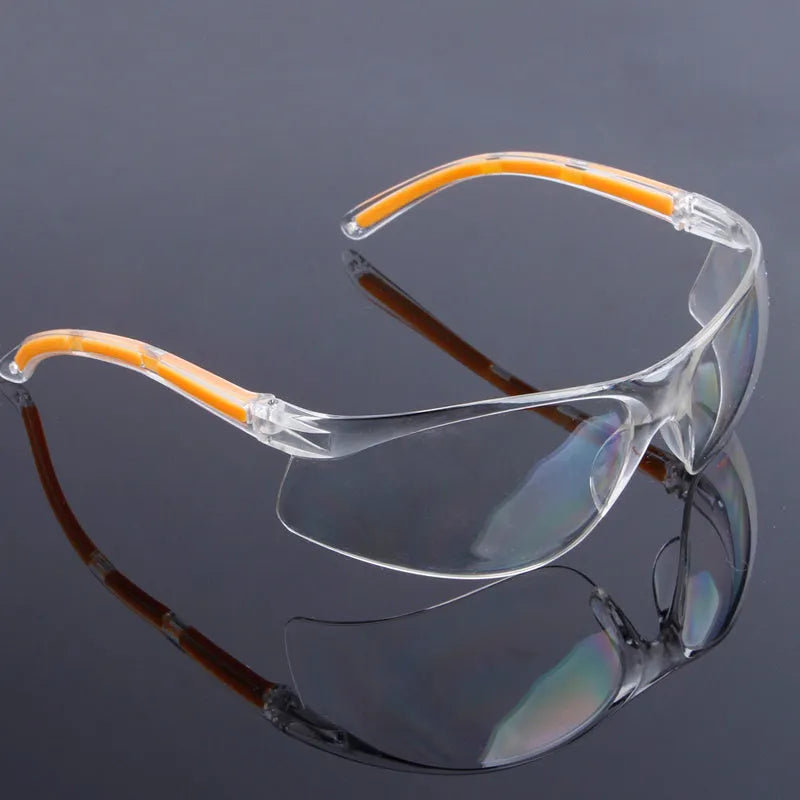 Transparent labour protection safety goggles with yellow frame for industrial and laboratory eye protection