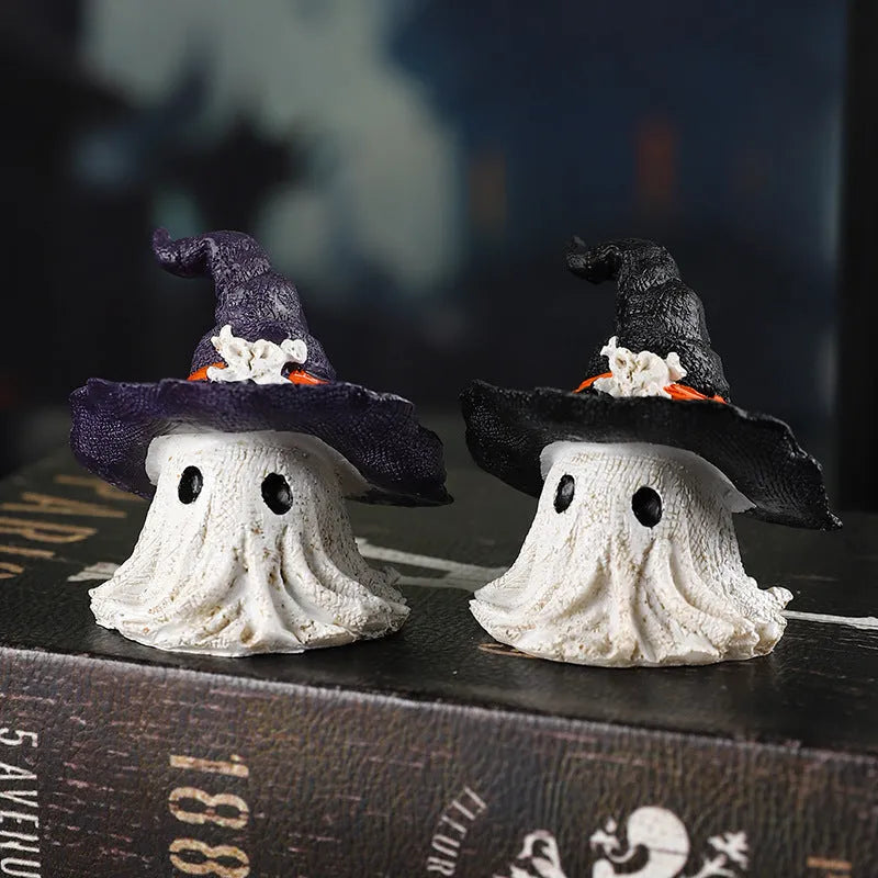 Purple and black resin wizard hat and ghost holiday ornaments.