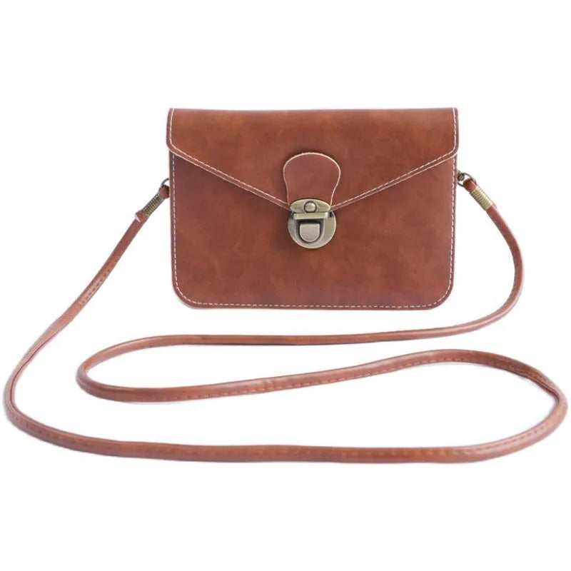 Soft retro cross square flap messenger bag in wine red, shown with lock detail and crossbody strap.