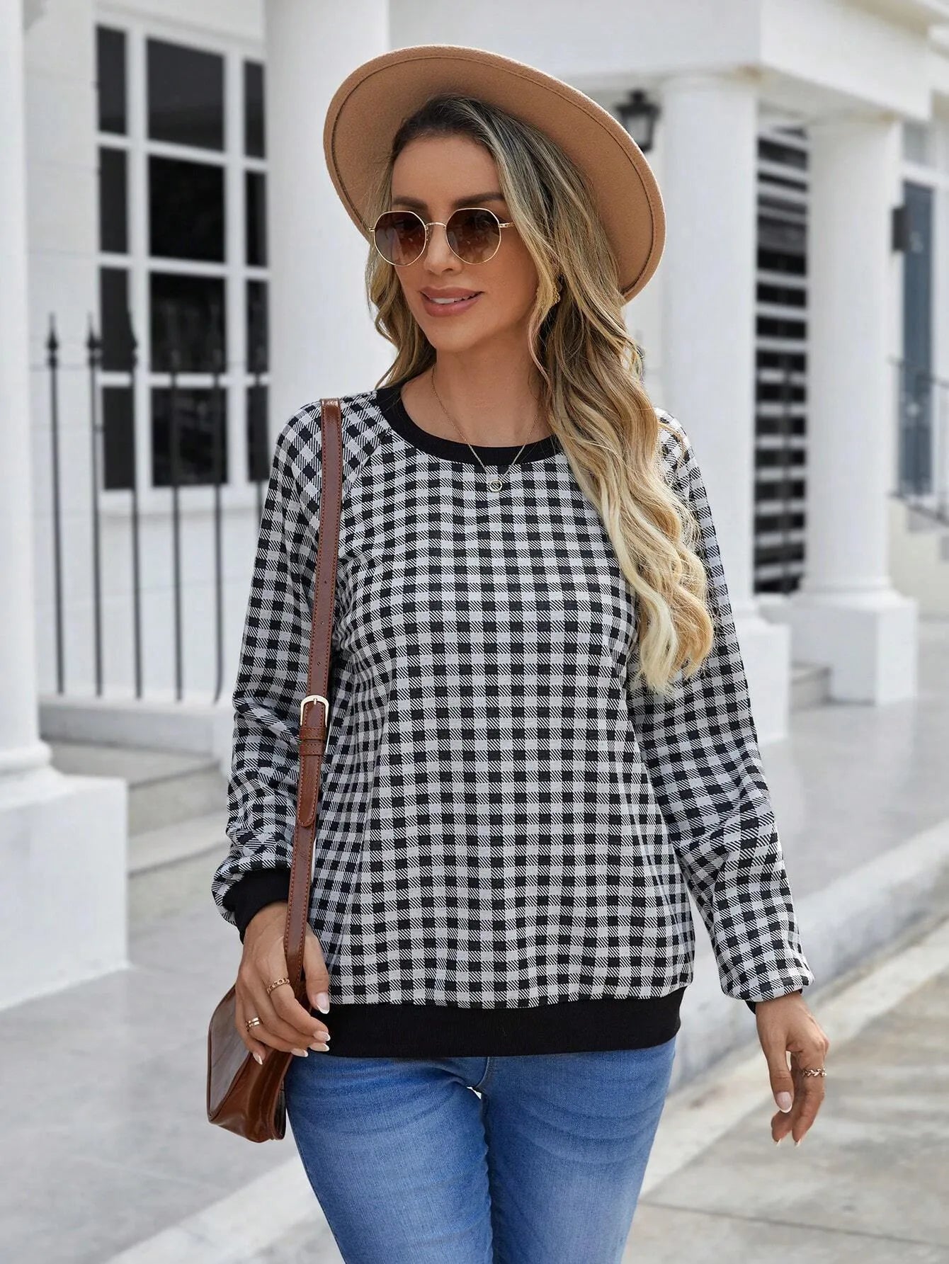 Black long sleeve polyester pullover sweater with a printed Japanese sweet plaid stripe pattern.