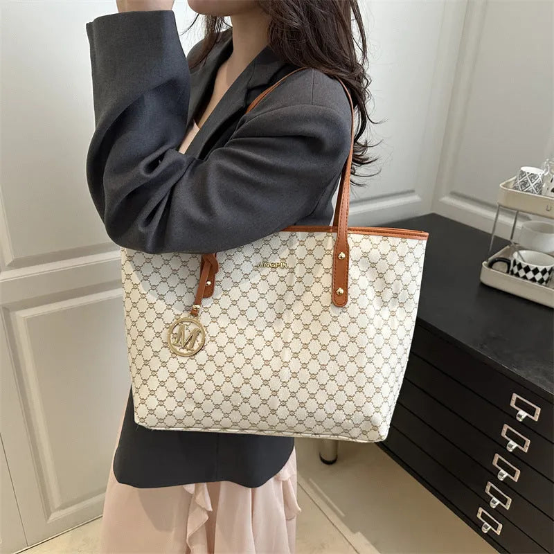 Western style women's shoulder bag in PU leather with contrast stitching, shown in black.