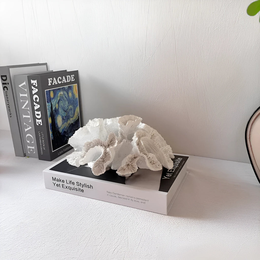 Off-white geometry coral ornament made from synthetic resin on a shelf