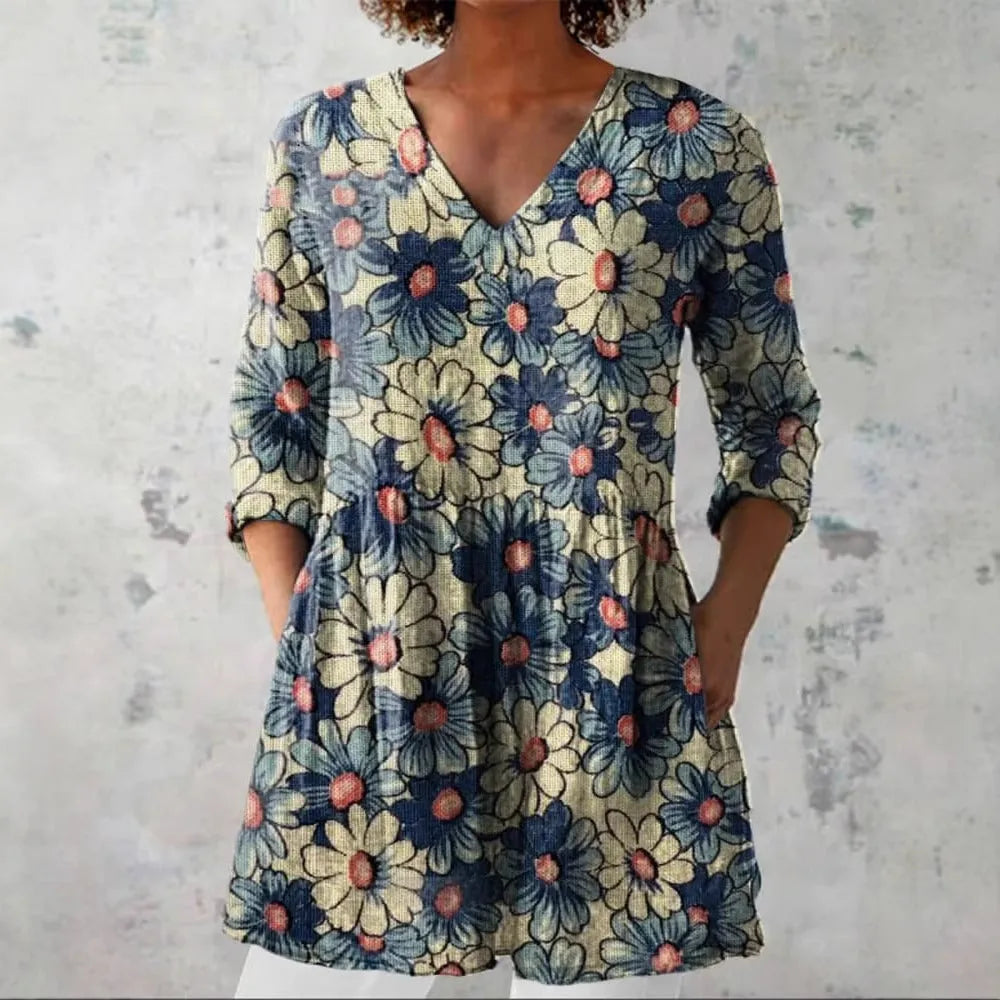Women's retro-style slim-fit long-sleeved top with a colourful digital print pattern, shown on a model.