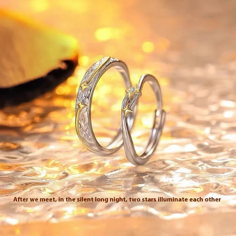 Pair of copper electroplated meteor shower star couple rings with adjustable opening on a flat surface