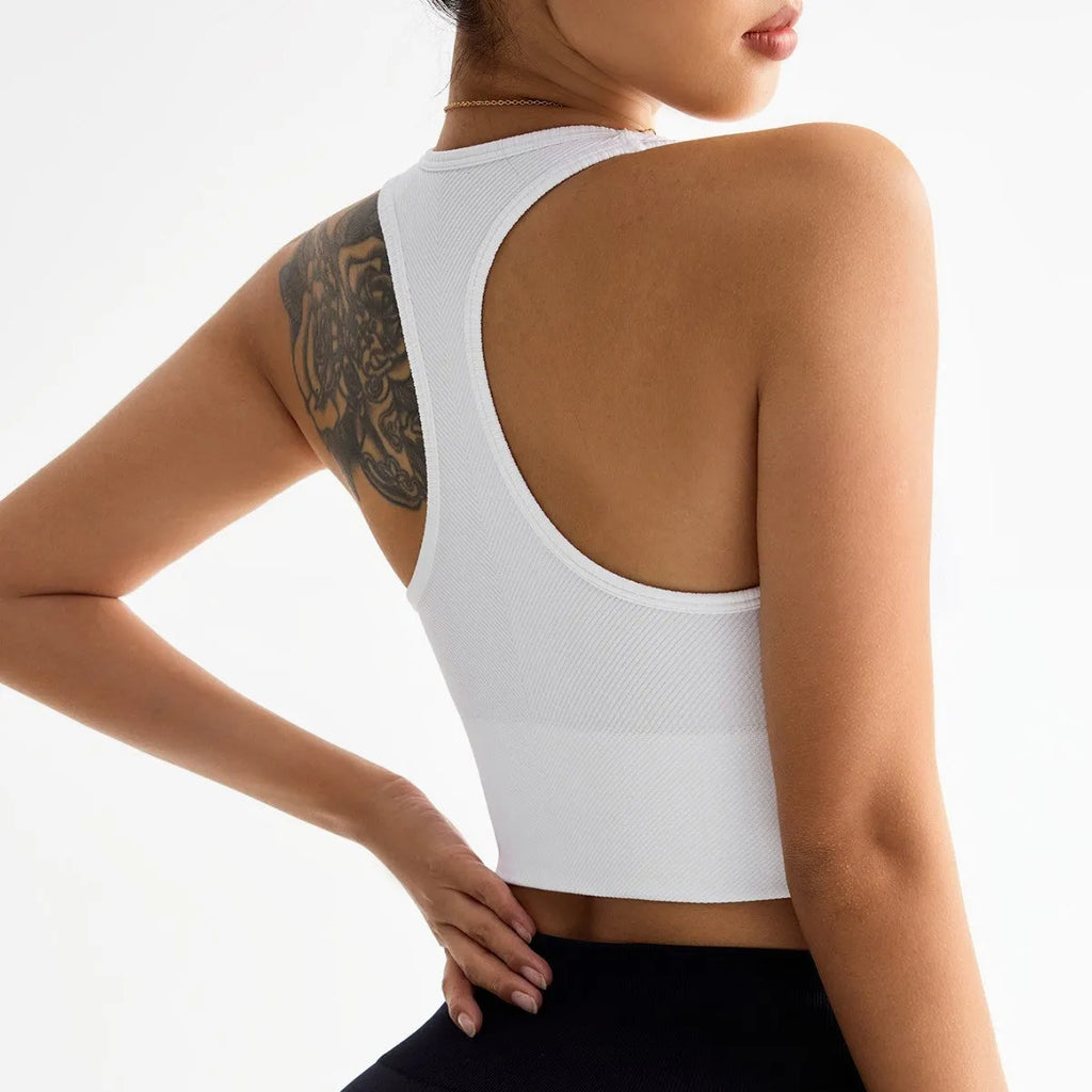Black women's cross-back sports bra with moulded cups on a hanger