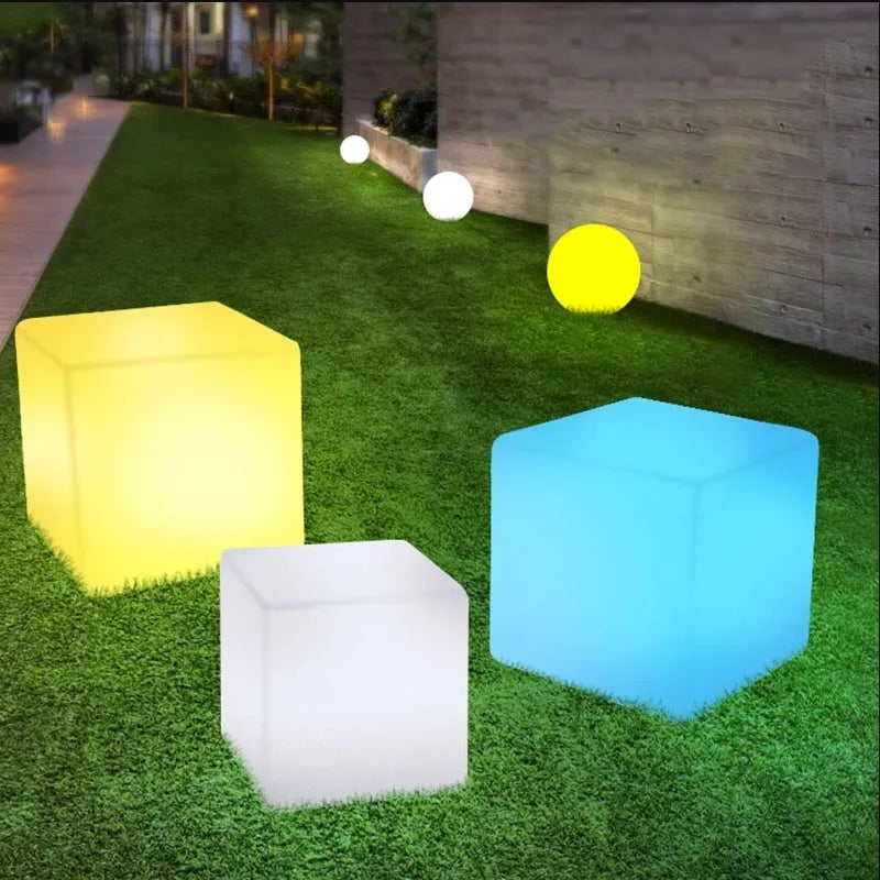 Modern square LED cube light for outdoor garden use, shown in various sizes.