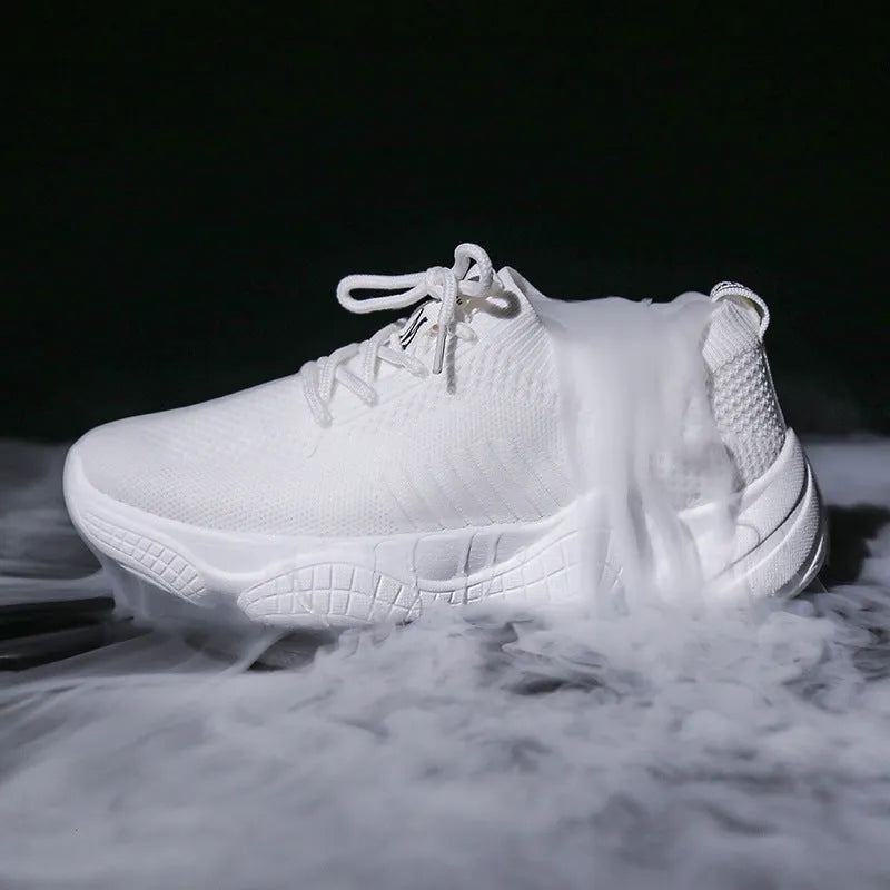 Women's white fly-knit sports shoes with thick rubber sole and front strap.