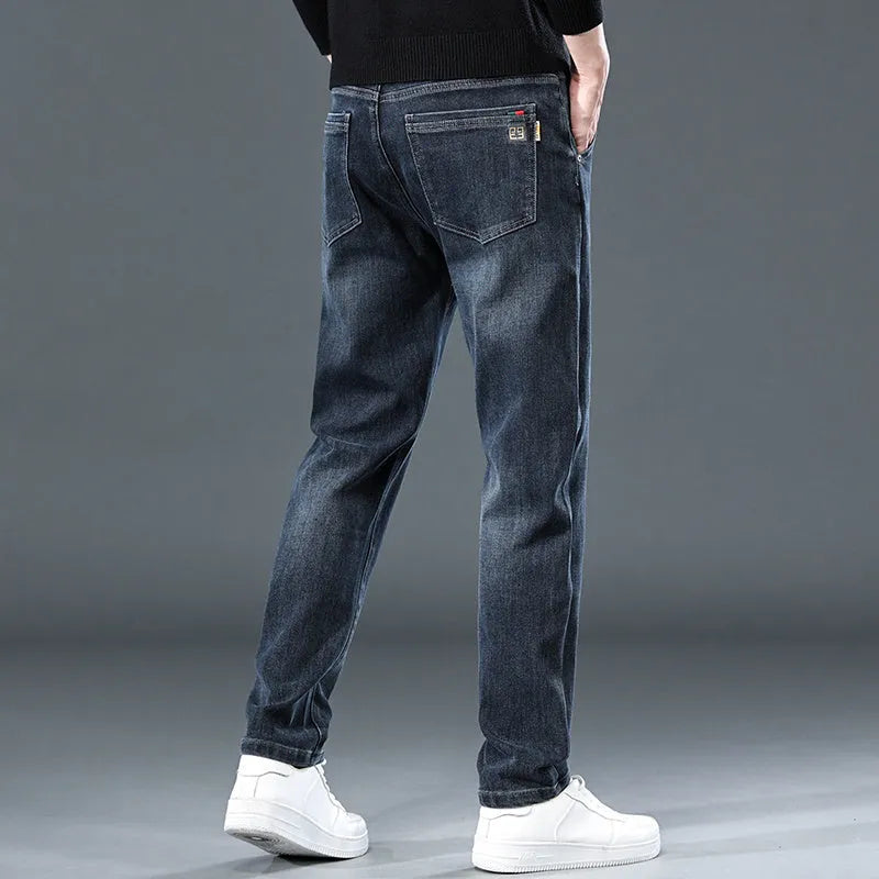 Blue grey slim straight casual trousers on a hanger, showing mid waist and straight leg design.
