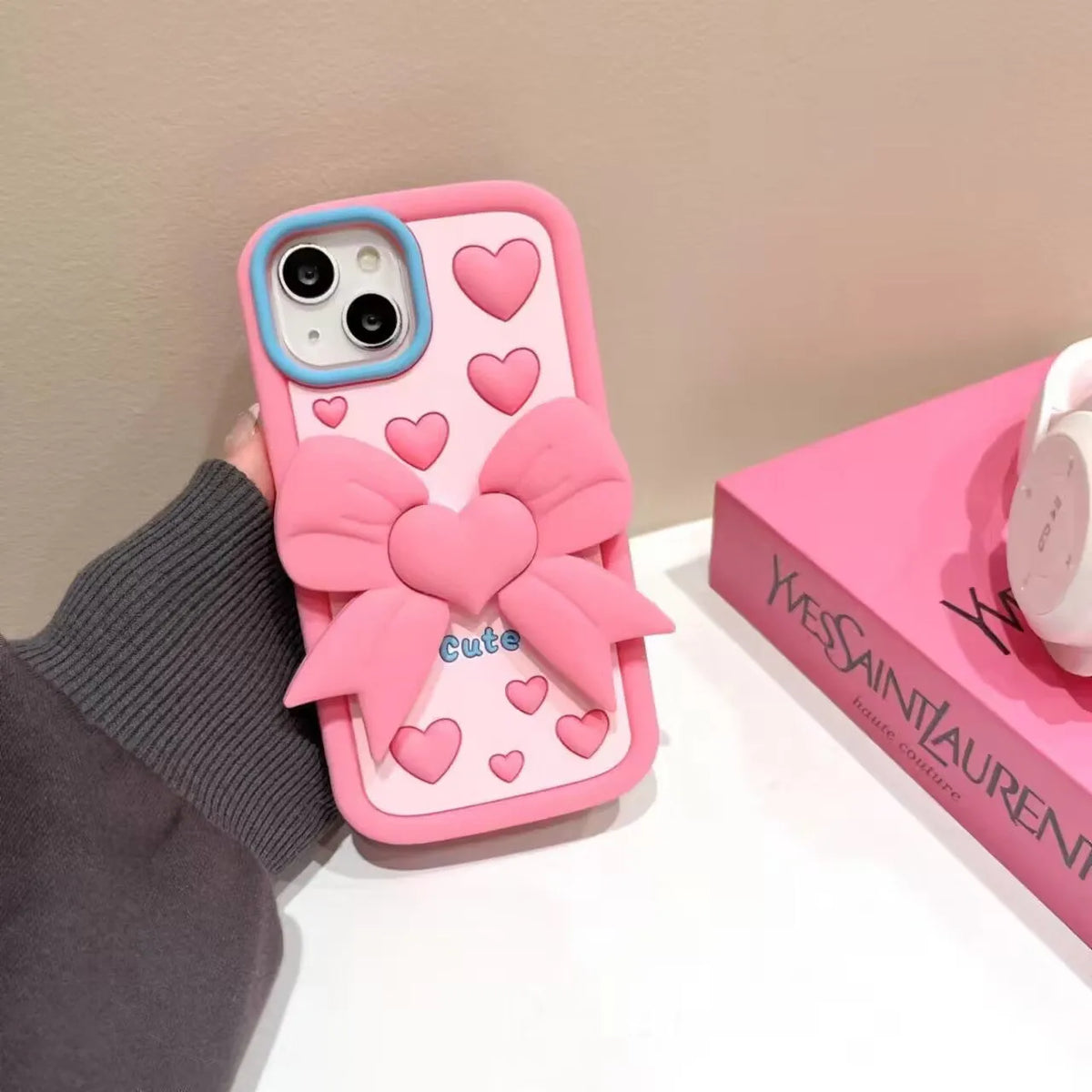 Pink 3D bow heart silicone phone case with hidden holder on iPhone, matte finish, Japanese Korean style design