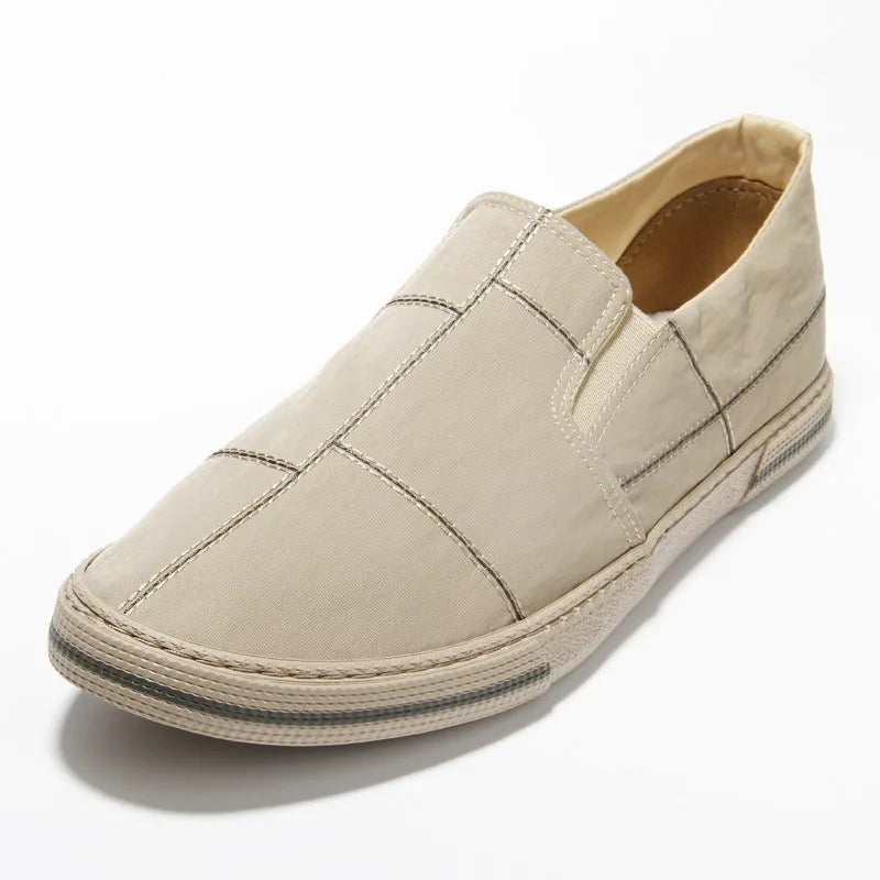 Men's low-top slip-on canvas shoes in khaki colour with a round toe and vulcanised rubber sole.