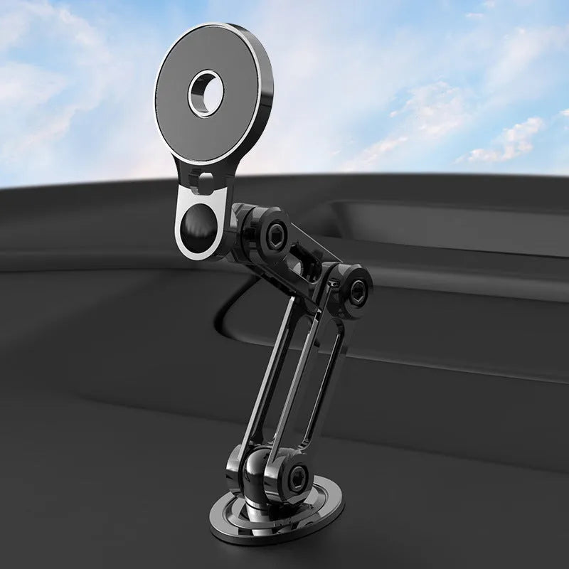 Black magnetic car phone holder mounted on dashboard with phone attached showing 360-degree rotation capability