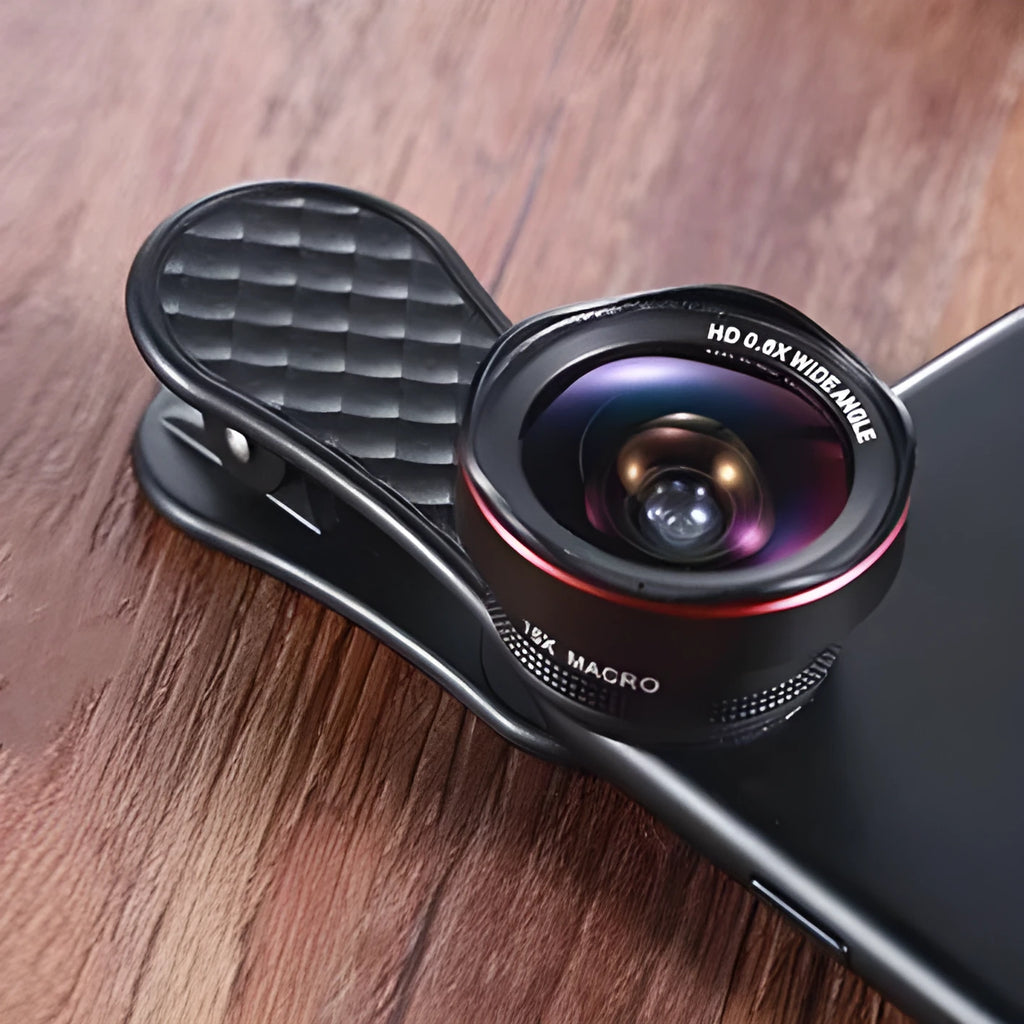 Black mobile phone wide-angle and macro lens kit with mounting clip and storage box on a table