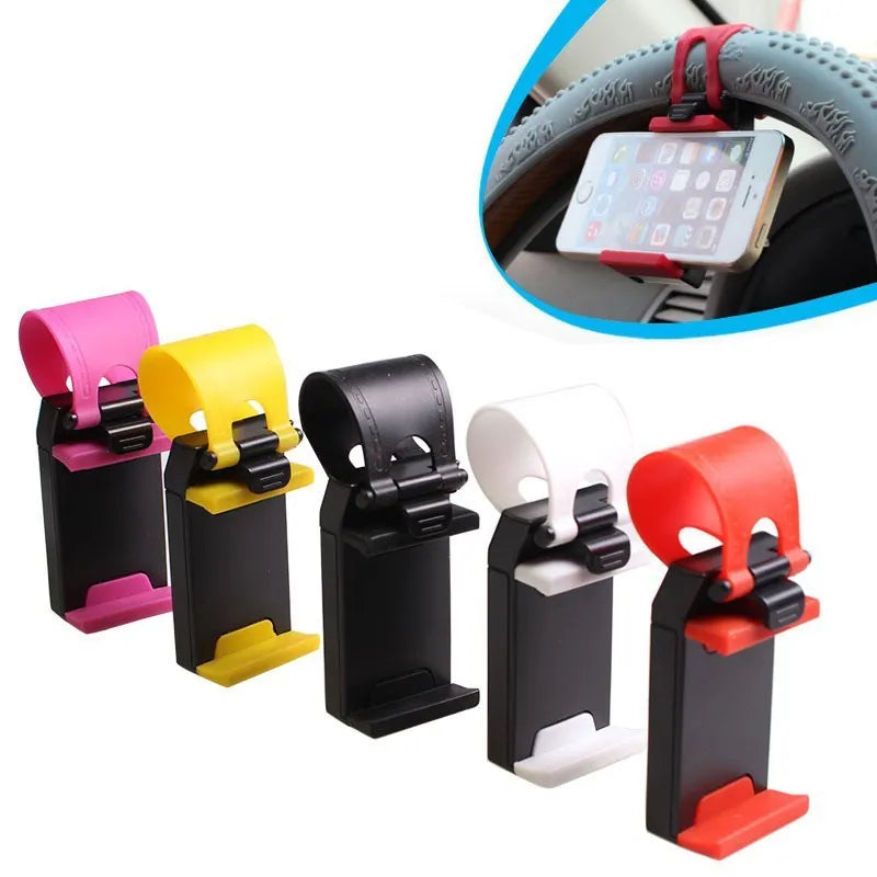 Black universal steering wheel phone clip holder with silicone pad mounted on a car steering wheel.