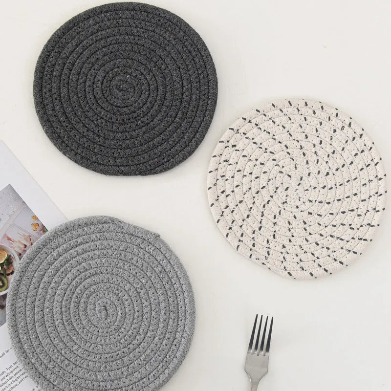 Three round cotton cord coasters in blue colour with modern simplicity design