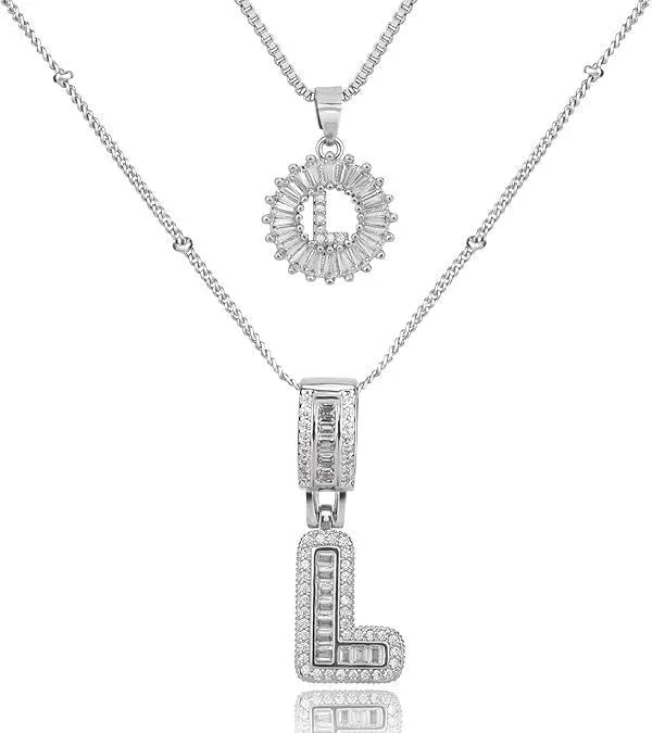 26 English letters copper-plated gold diamond initial pendant necklace with adjustable chain on display