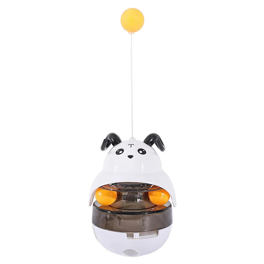 Interactive cat feeder toy with sounding bell and car tower shape in brown, grey, pink, and white
