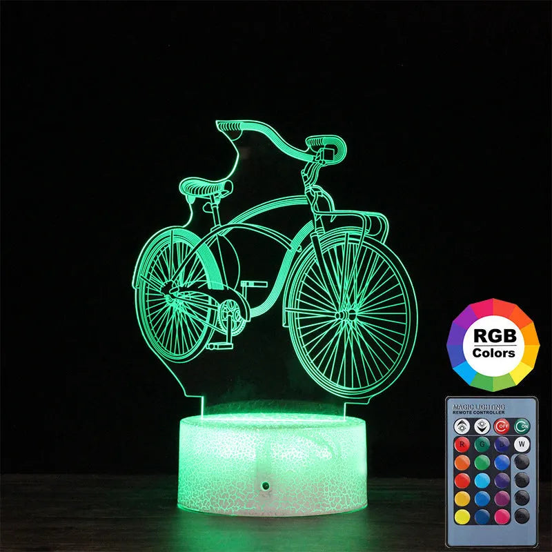 3D bicycle LED night light with acrylic shade and black base on a desk