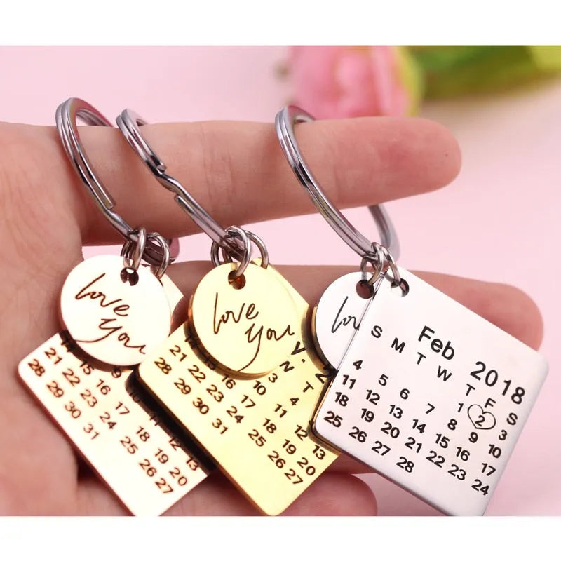 Custom engraved stainless steel calendar keychain with date, gold plating, 30x30mm, on a white background