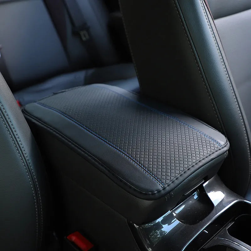 Black PU leather car armrest box cushion mat with red line pattern, measuring 32cm by 19cm.