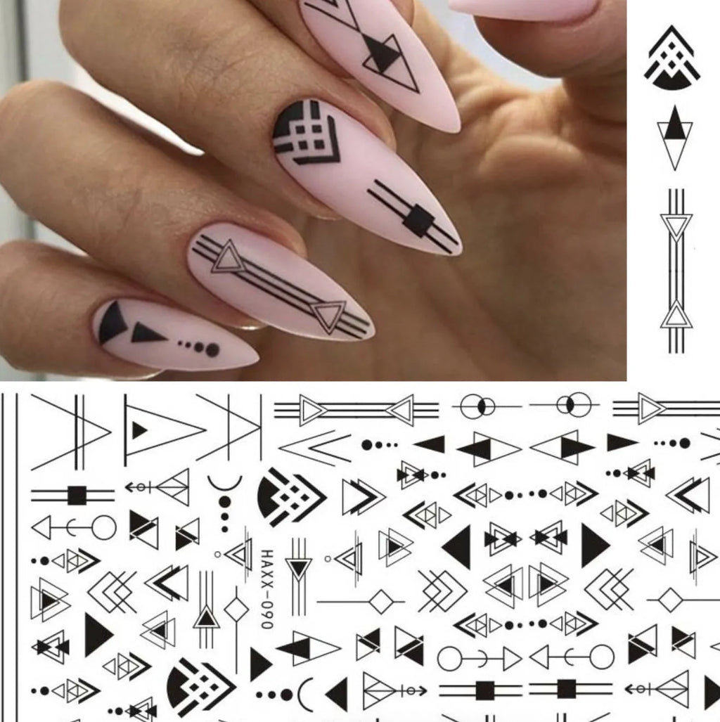 Black butterfly nail stickers with white flower and gold accents on a manicured hand, adhesive decal set