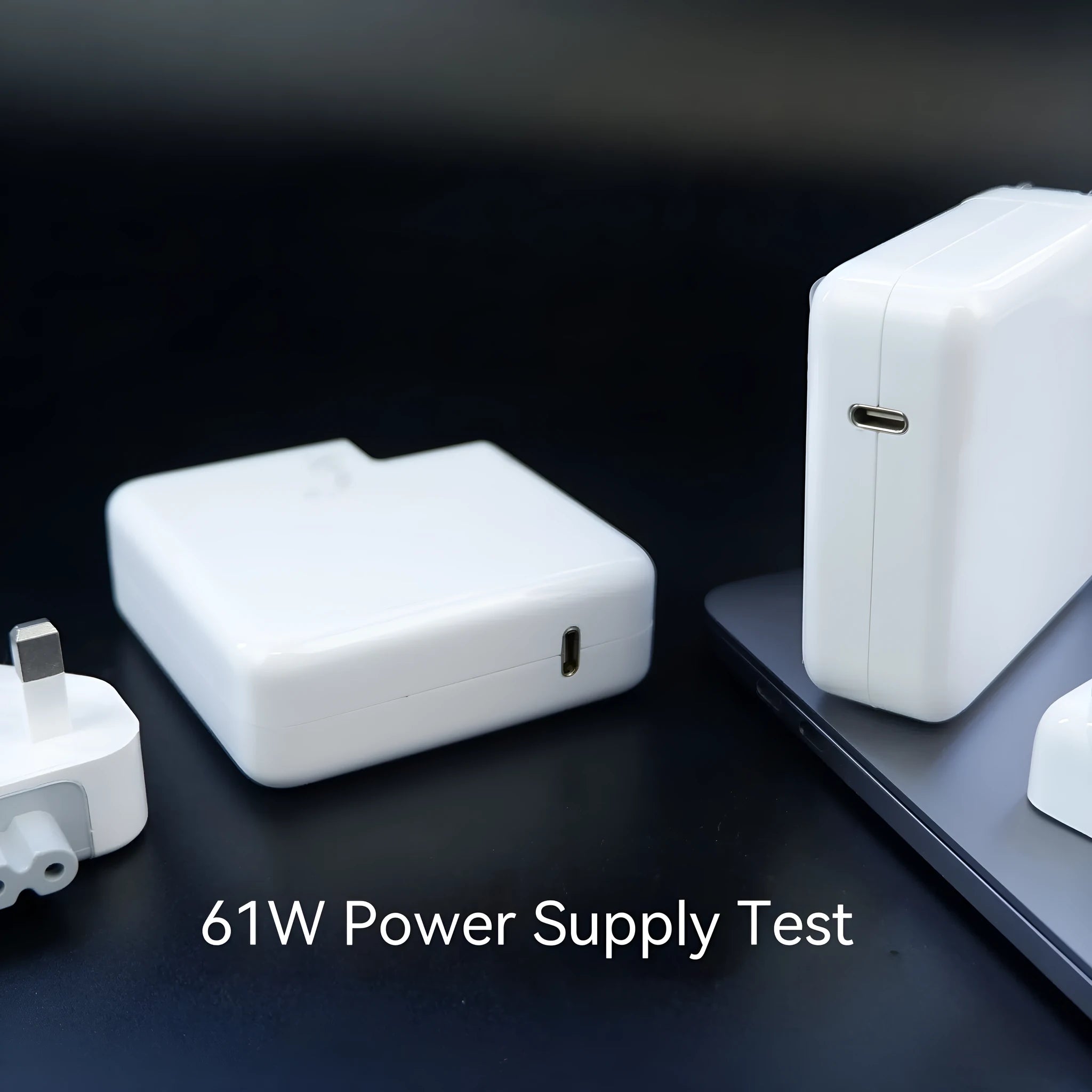 61W laptop power adapter charger with international plug options, 7cm by 7cm by 3cm dimensions