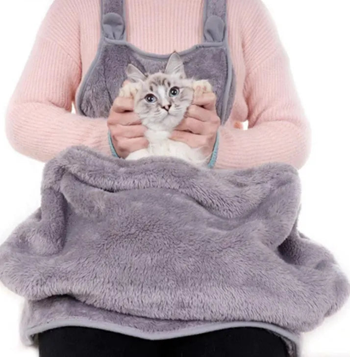 Grey pet carrying bag with sleeping chest apron on a table, showing double-sided arcum material and 70x62 cm size