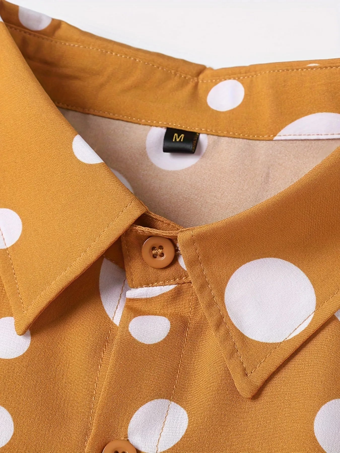 Men's warm orange long-sleeved shirt with white polka dot print and classic lapel collar