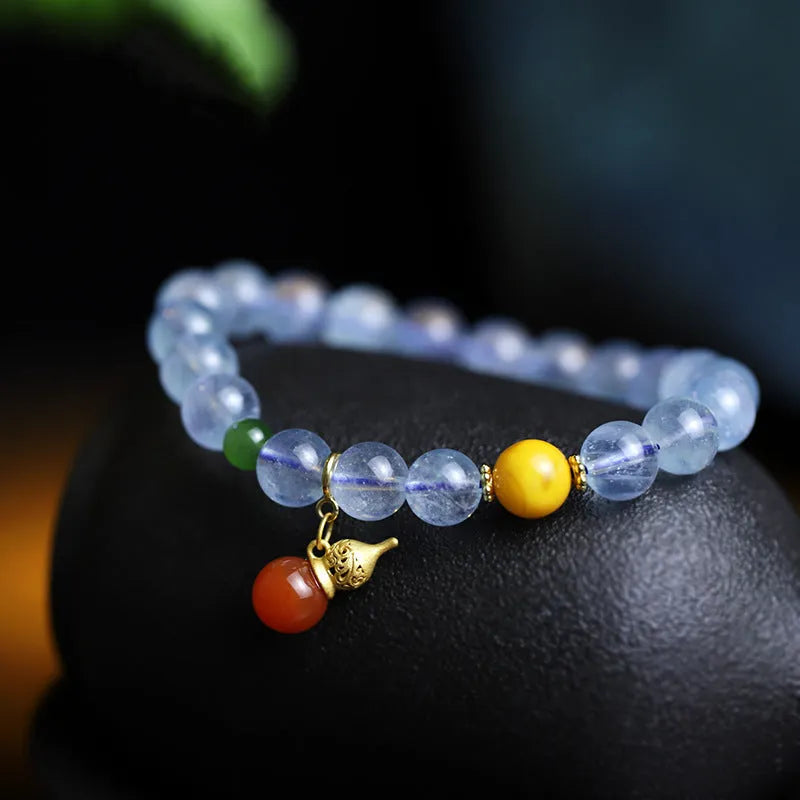 Women's geometric bracelet with blue 8mm aquamarine beads and ethnic retro design.