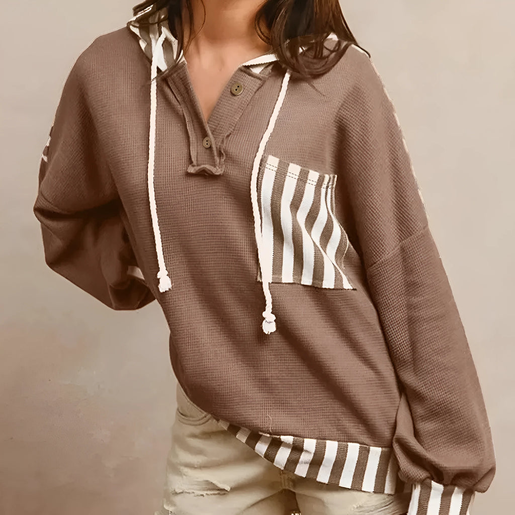 Straw yellow women's hoodie with waffle texture and striped patchwork design, featuring a button neck and drawstring waist.