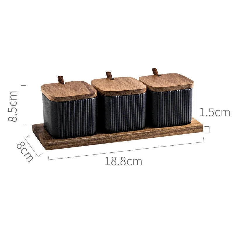 Ceramic seasoning jar set with matte glaze and natural log accents in black, blue, and white