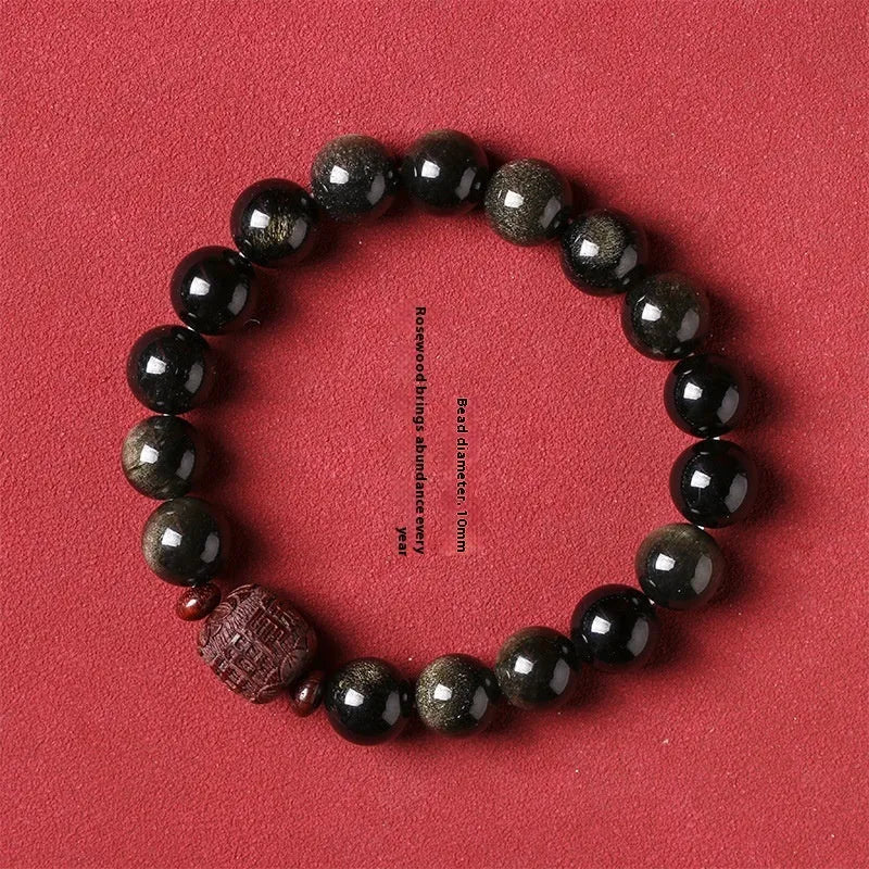 Close-up of a hand-woven Better Luck Beads bracelet with 10mm round Golden Obsidian beads in a retro style.