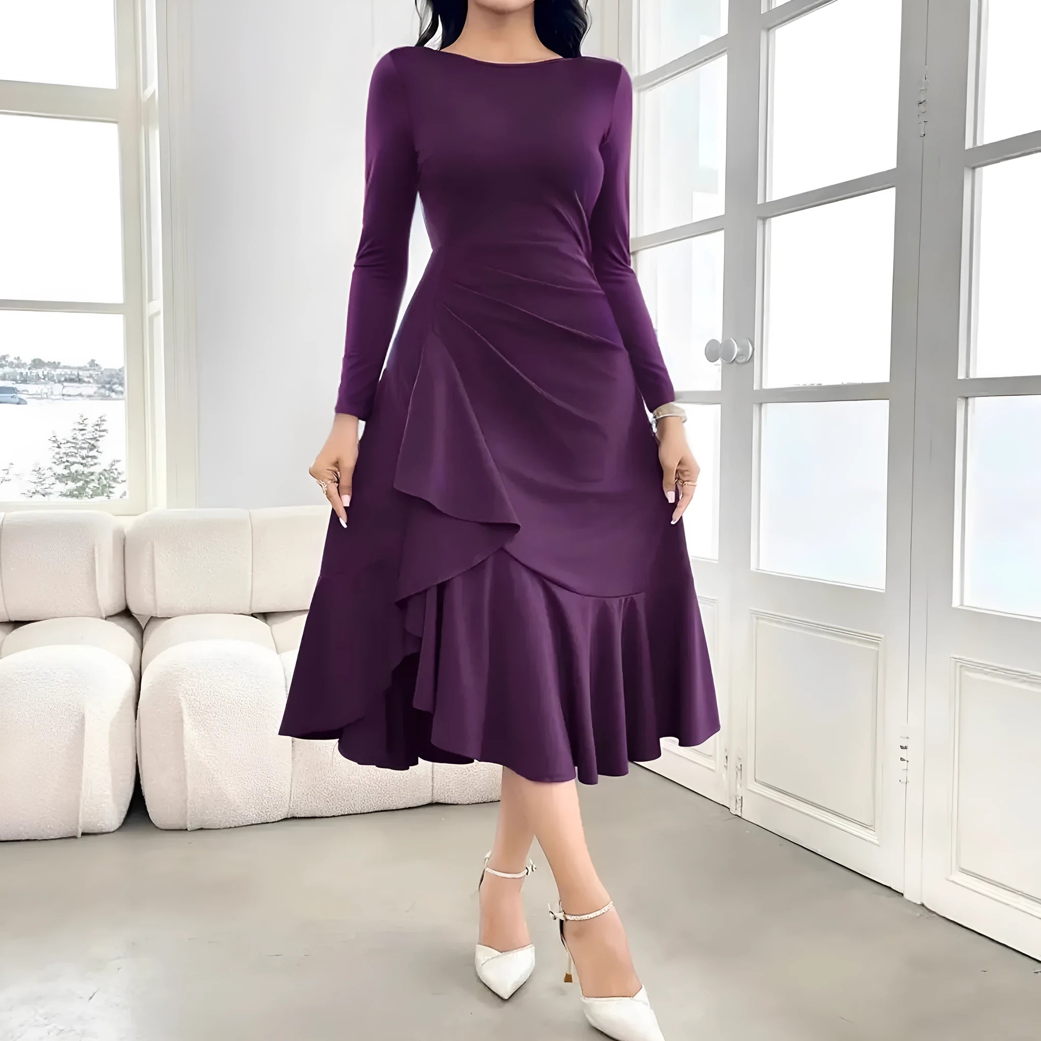 A purple women's long sleeve dress with ruffles and a round neck, shown on a hanger.