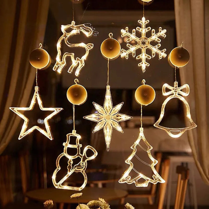 Battery powered LED decorative light with suction cups showing Santa Claus and snowman designs on a window.