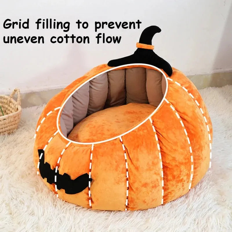 Halloween-themed orange pumpkin-shaped soft plush bed for a cat or small dog, featuring a cartoon devil design.