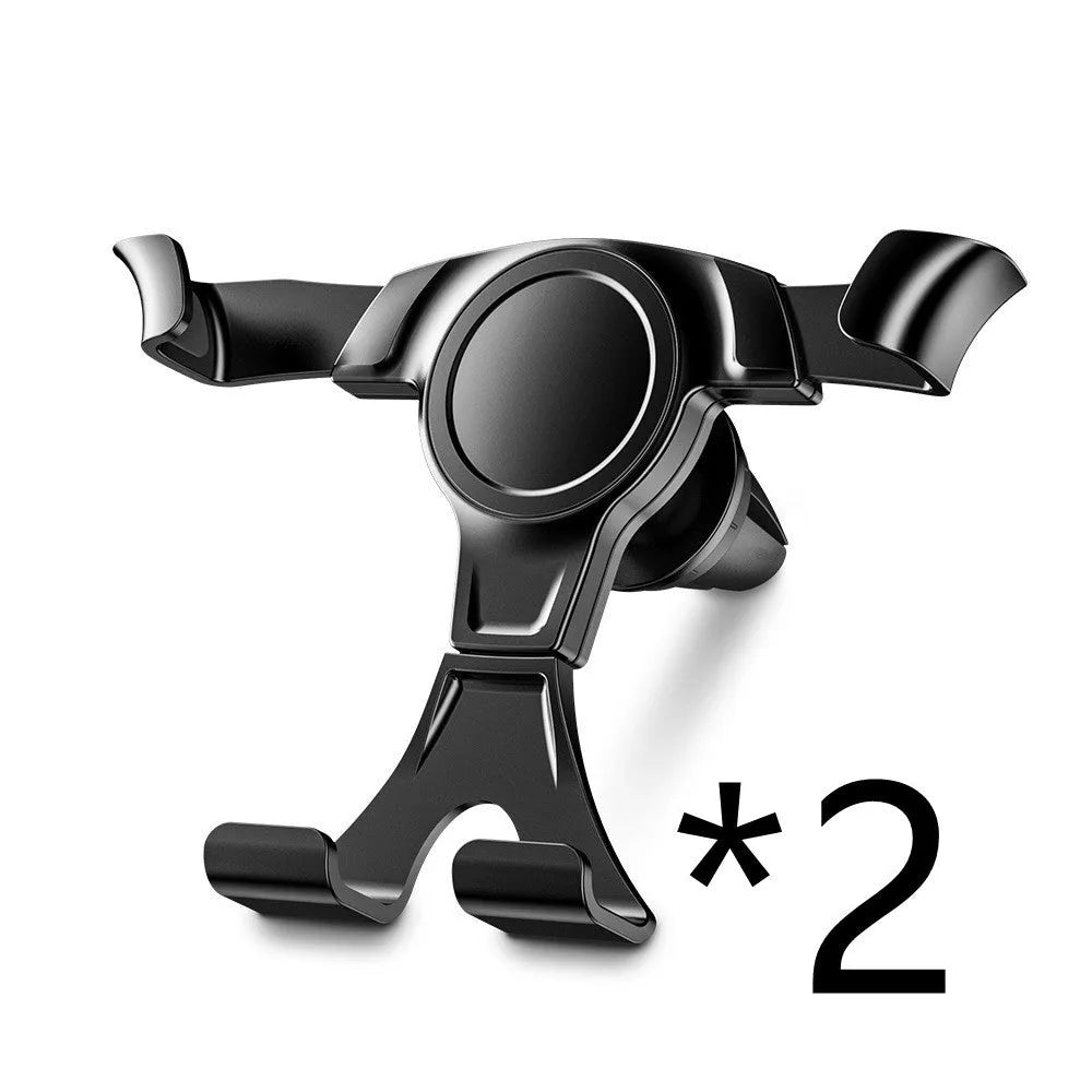 Black plastic car phone holder clipped to a car air vent with a smartphone inserted