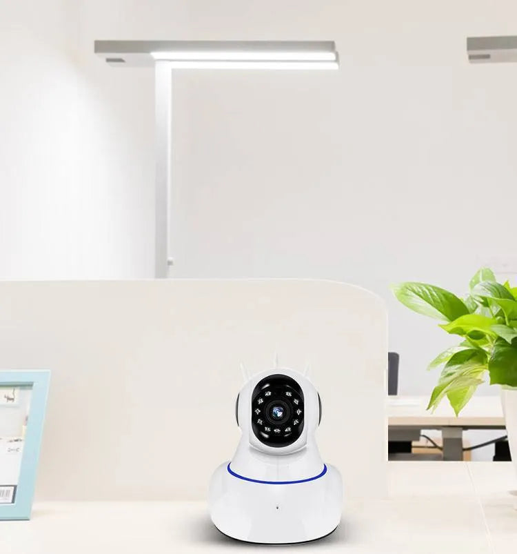 White wireless dome security camera with 2MP sensor on a flat surface.