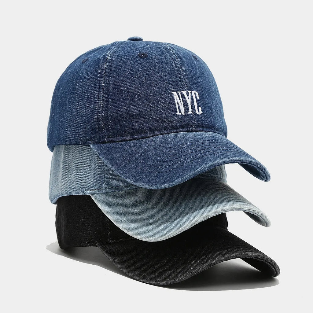 Adjustable denim peaked cap with embroidered lettering in light blue, dark blue, or black