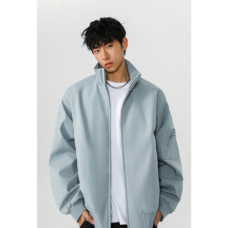 Men's large size multi-pocket short flight jacket in black, loose fit, polyester fiber fabric with visible pockets.