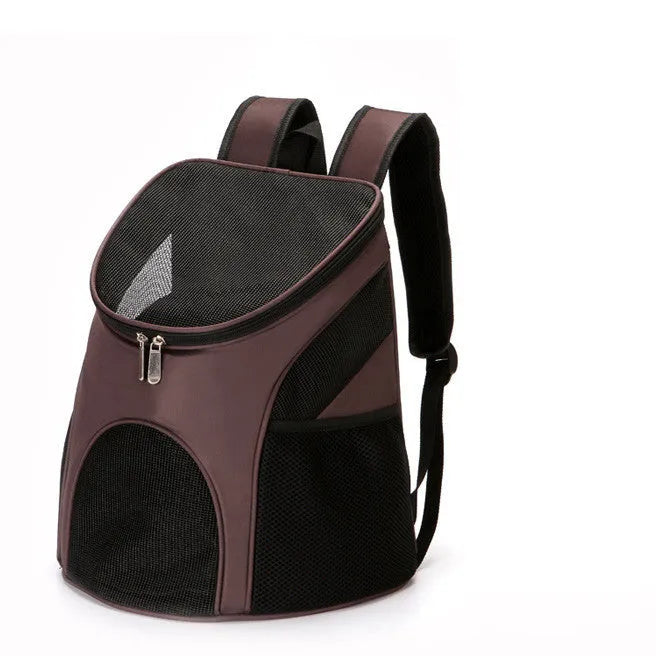 Red pet backpack carrier with ventilation windows and adjustable straps for a dog or cat.