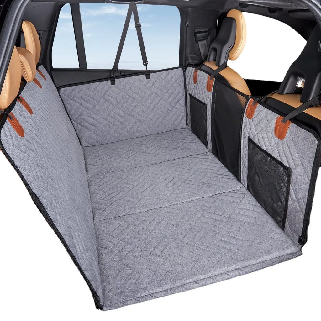 Black waterproof car dog bed cushion on rear seats protecting against pet mess