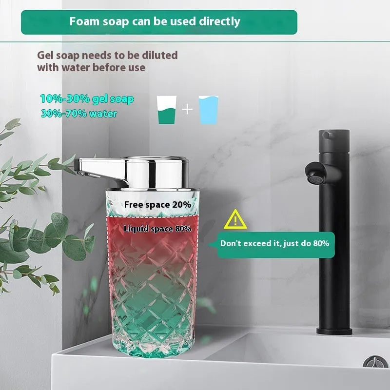 Silver automatic sensor soap dispenser with USB Type-C charging port on a bathroom counter.